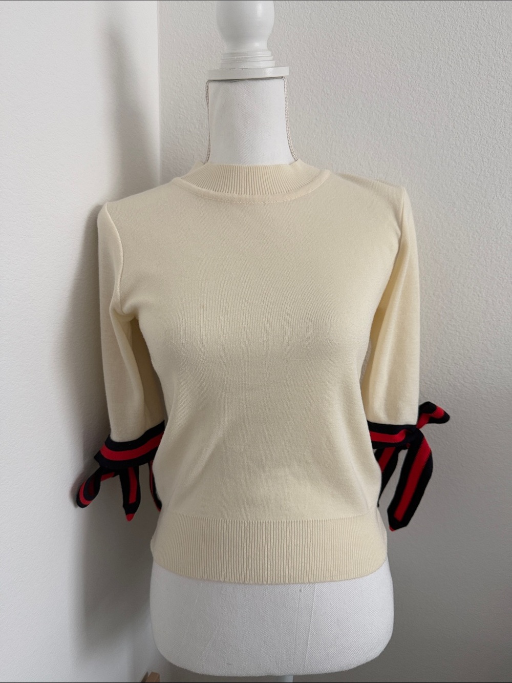 Cream Knit Sweater with Red & Black Bow Sleeve Accents